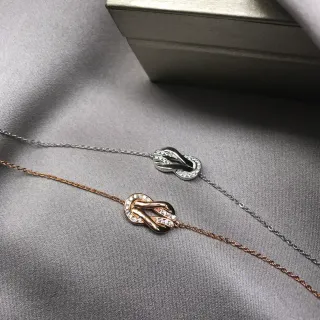 Collier pendentif noué pavé-set pierres claires en or et argent