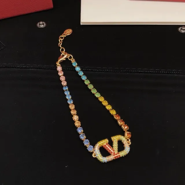 Rainbow Crystal-Encrusted Gold-Tone V Motif Bracelet 3