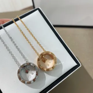 Collier pendentif cadre circulaire ouvert en argent et or avec charme géométrique suspendu