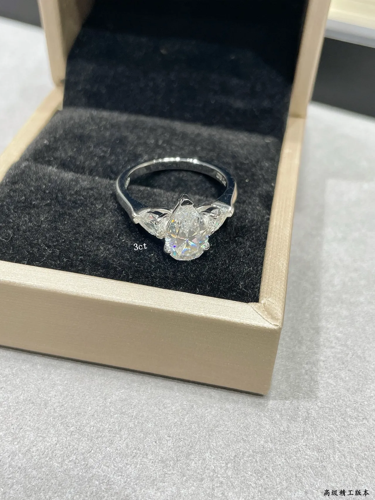 Silver Pear-Cut Center Stone Tapered Side Stones Ring 7