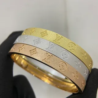 Louis Vuitton Gold Silver Embossed Monogram Rigid Bangle Bracelet