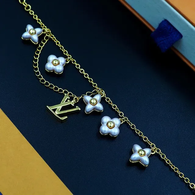 Louis Vuitton Gold-Tone Floral Charm Bracelet 7