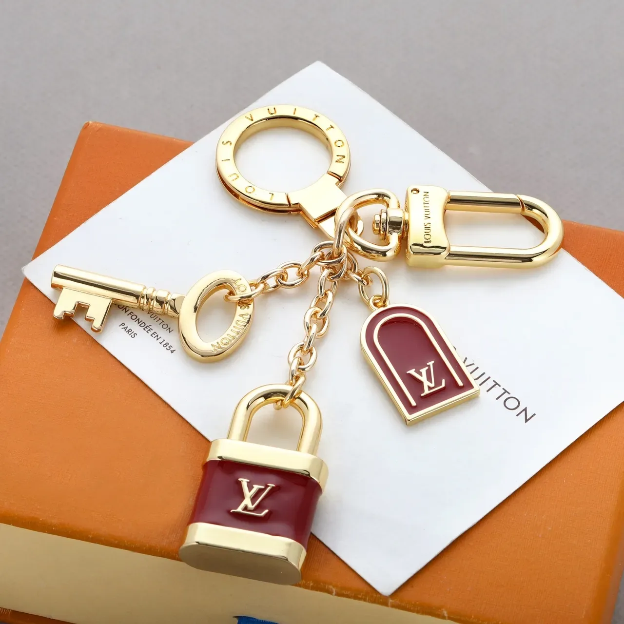 Louis Vuitton Lock & Key Red Enamel Gold-Tone Charm Bracelet 7