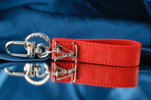 Louis Vuitton LV Initiales Brown Beige Embossed Monogram Leather Polished Metal Logo Wristlet 8