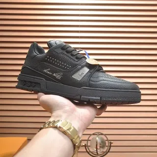 Louis Vuitton LV Trainer Black Gold Pebbled Leather Upper Layered Rubber Midsole Lifestyle Sneakers