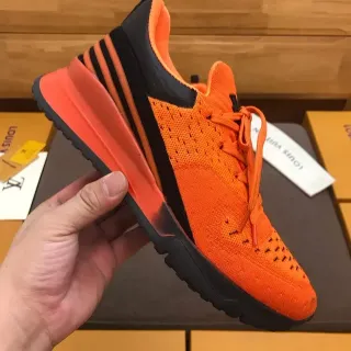 Louis Vuitton LV Trainer Zapatillas Lifestyle con Upper de Punto Naranja Negro y Suela Esculpida