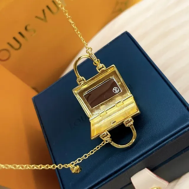 Louis Vuitton Petite Malle Gold Miniature Handbag-Shaped Monogram-Embossed Necklace 5