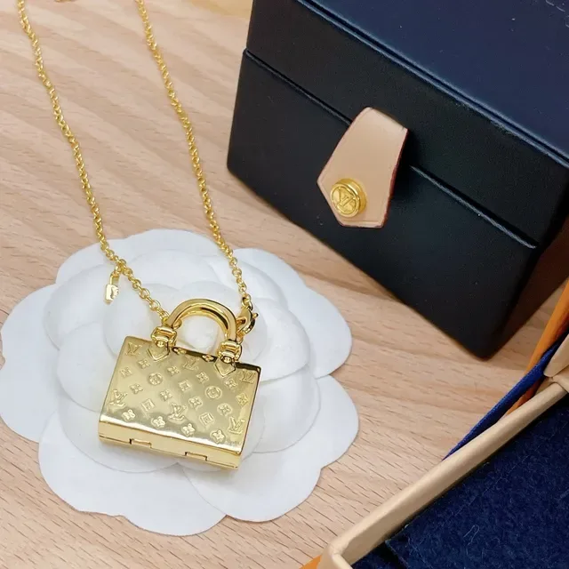 Louis Vuitton Petite Malle Gold Miniature Handbag-Shaped Monogram-Embossed Necklace 7