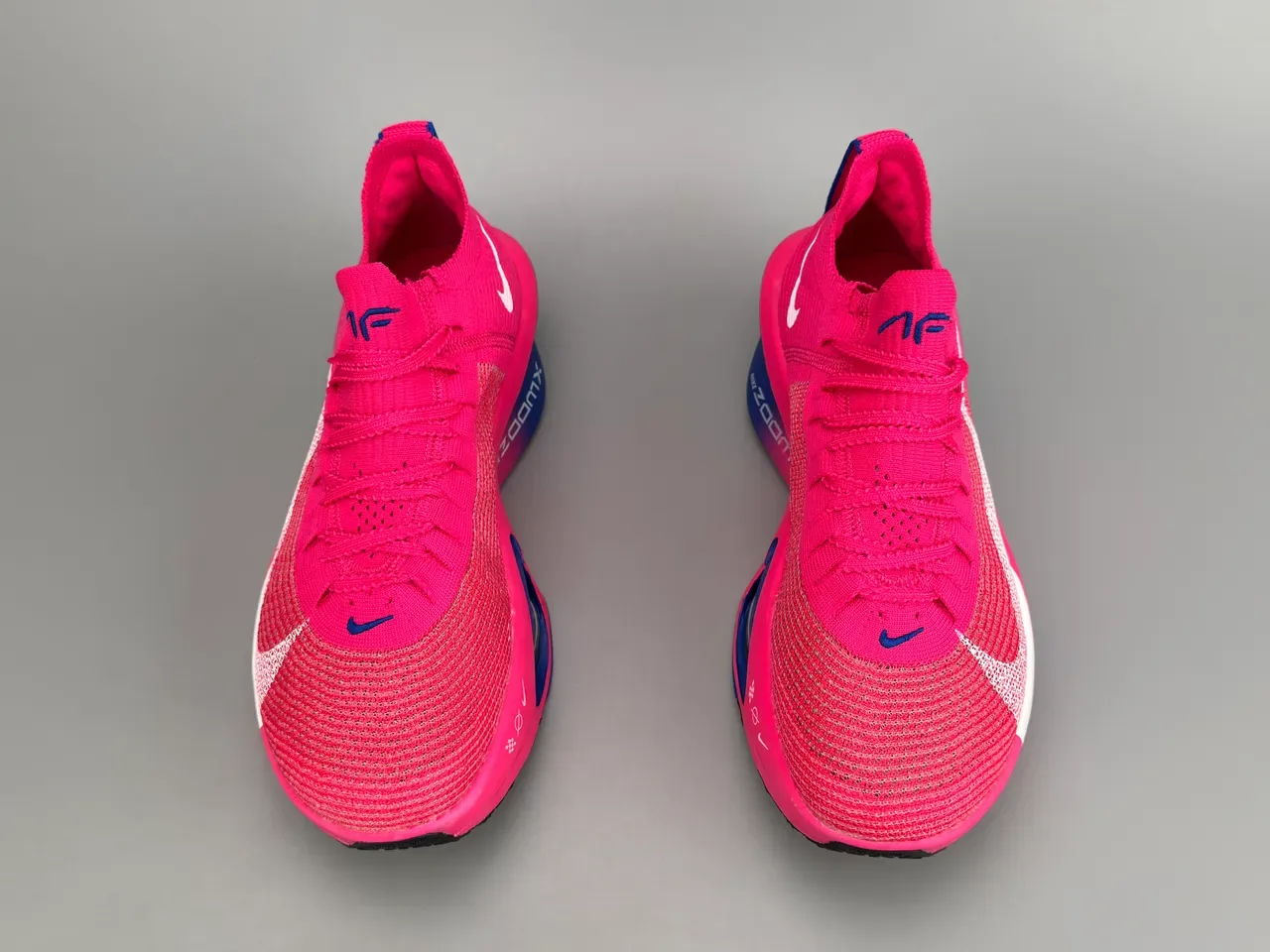 Nike Air Zoom Alphafly Tênis de Corrida Rosa Azul Superior em Malha Unidade Visível 7