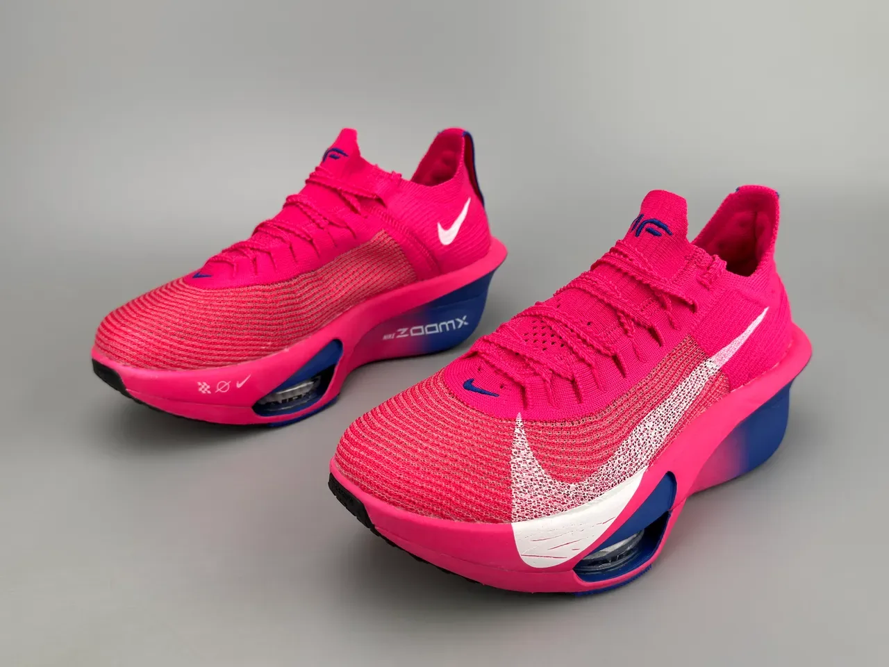 Nike Air Zoom Alphafly Tênis de Corrida Rosa Azul Superior em Malha Unidade Visível 9