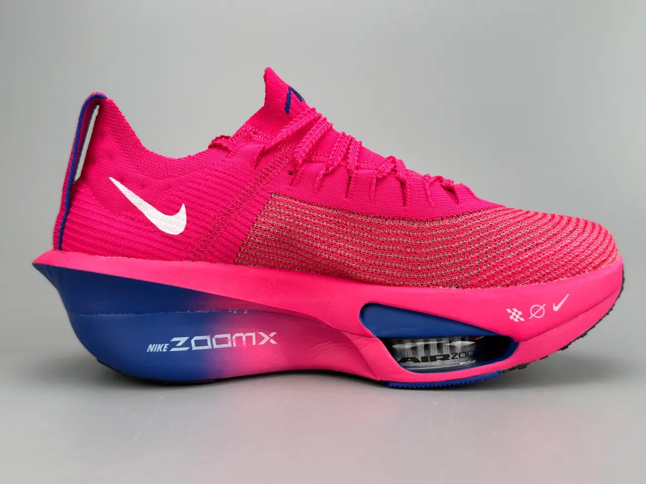 Nike Air Zoom Alphafly Tênis de Corrida Rosa Azul Superior em Malha Unidade Visível 10
