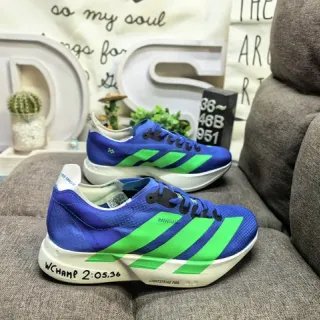 Adidas Chaussures De Running Avec Upper En Maille Bleu Vert Avec Branding De Trois Rayures