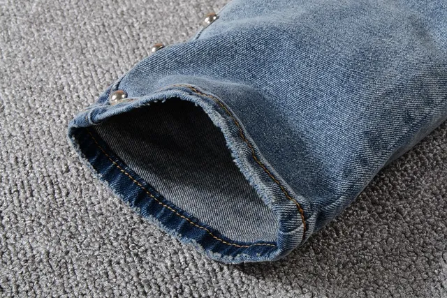 Balmain Studded Distressed Light-Wash Jeans 15