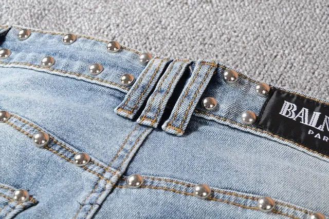 Balmain Studded Distressed Light-Wash Jeans 16