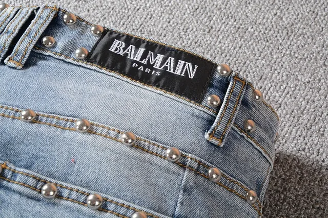 Balmain Studded Distressed Light-Wash Jeans 17