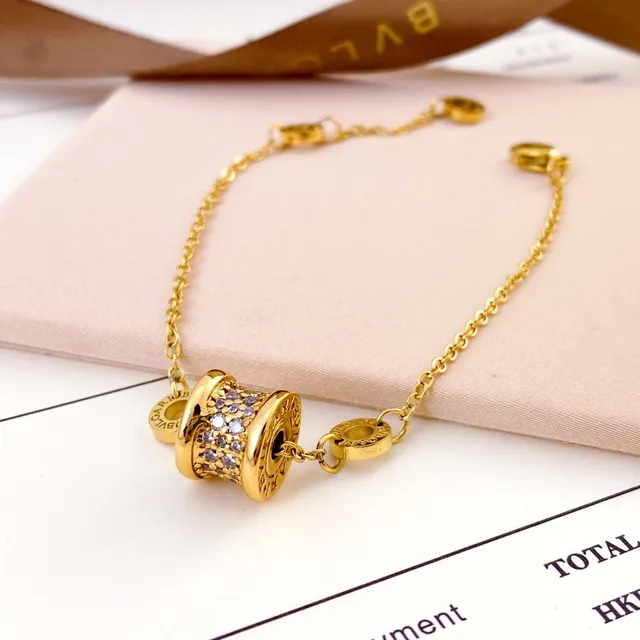 Bvlgari B.zero1 سوار ذهبي فضي تعويذة أسطوانية برميلية إعداد بافيه للكريستال 3