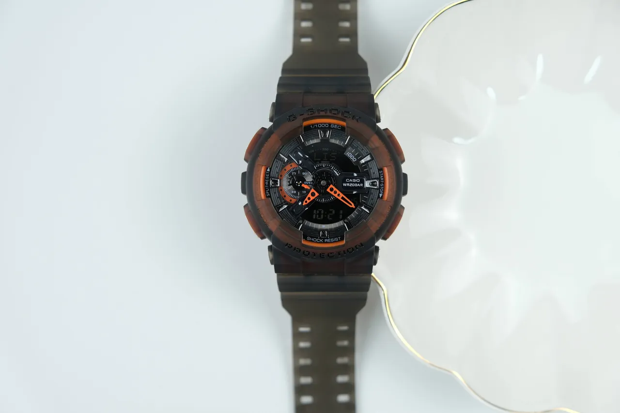 Casio G-Shock GA-100 ساعة رياضية أسود شفاف برتقالي 6