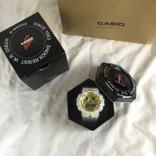 Casio G-Shock GA-100 ساعة رياضية أبيض شفاف وذهبي