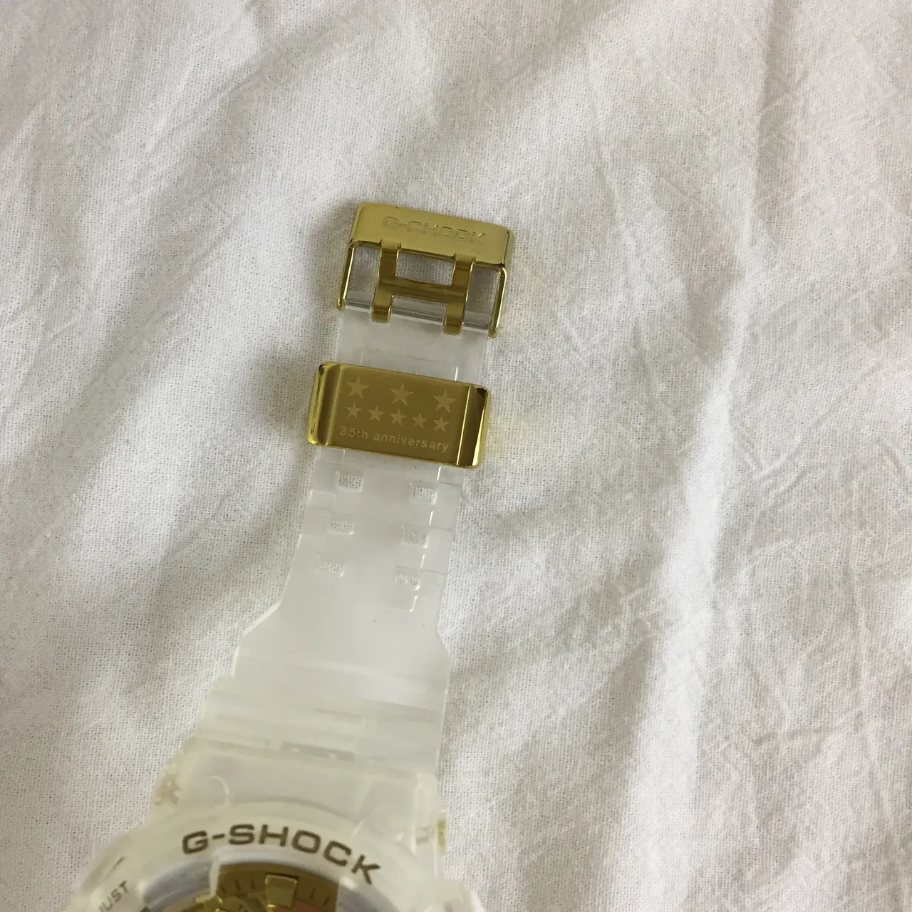 Casio G-Shock GA-100 Relógio Esportivo Branco Translúcido e Dourado 4