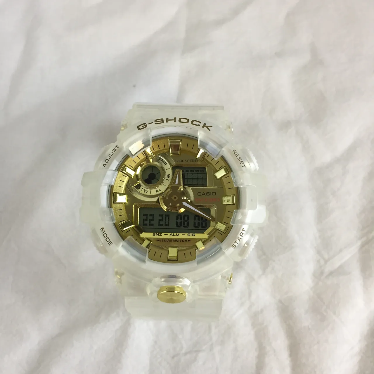 Casio G-Shock GA-100 Relógio Esportivo Branco Translúcido e Dourado 7