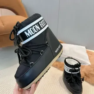 Bottes de neige isolées à lacets noir et crème
