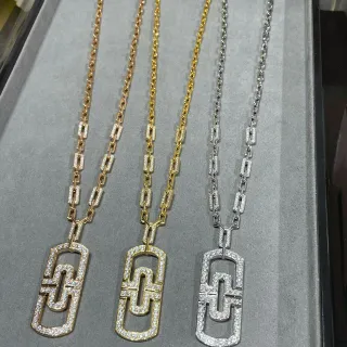 Collier pendentif géométrique en or et argent avec pierres pavé-set