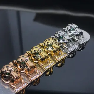 Pulsera de metal multitonos con motivo de cabeza de pantera en oro y plata