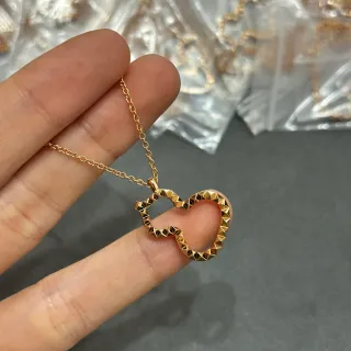Collier pendentif de cœur ouvert facetté en ton doré