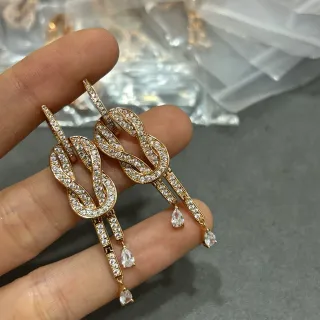 Gold-Tone Infinity Knot Pavé Teardrop Dangle Earrings