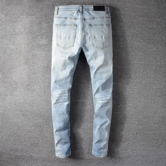 हल्की धुलाई distressed slim fit ripped जींस 16