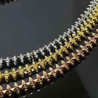 Pulseira metálica prateada dourada com pontas
