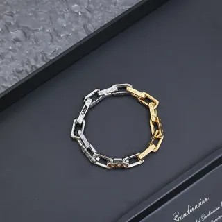Pulseira de metal com eslabões de corrente bicolor prata e ouro