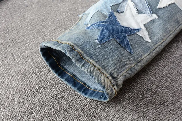 Star-Appliqué Distressed Light-Wash Slim Fit Jeans 8