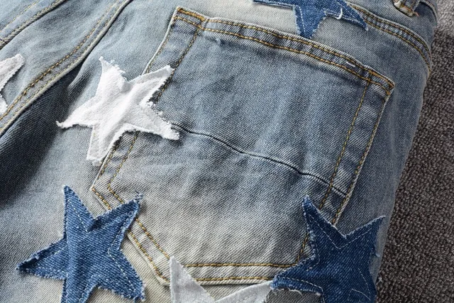 Star-Appliqué Distressed Light-Wash Slim Fit Jeans 10