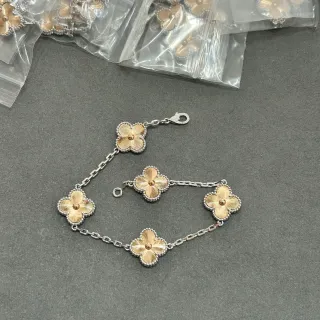 Pulsera con Charms Flor en Plata y Oro de Dos Tonos