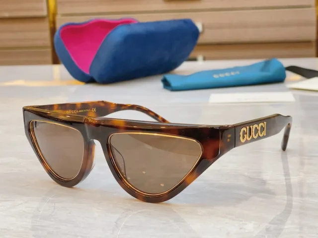 Gucci lunettes de soleil en acétate noir doré brillant avec détail de logo 8