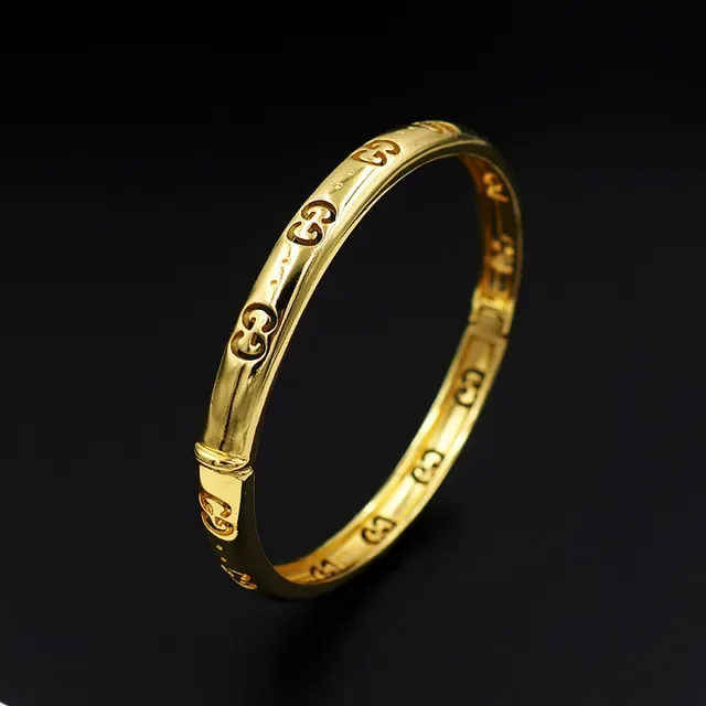 Gucci गोल्ड पॉलिश्ड इंटरलॉकिंग GG मोटिफ ब्रेसलेट 8