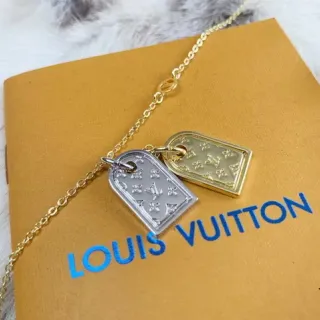 Louis Vuitton Collar con colgante de placa de perro en doble tono con monograma