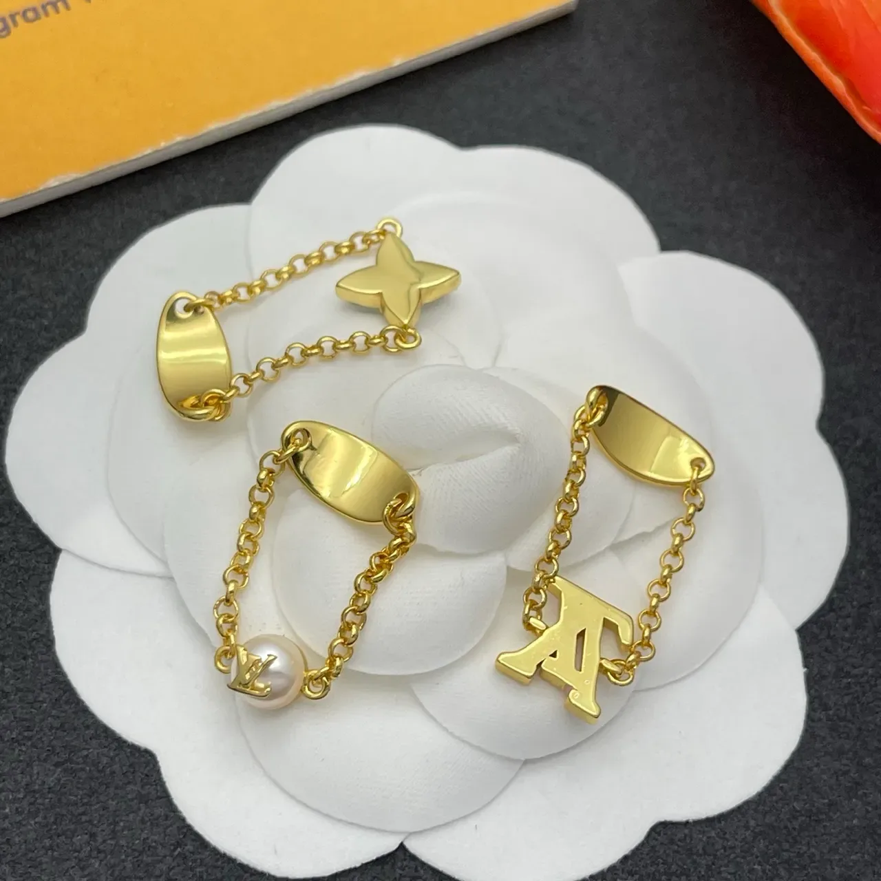 Louis Vuitton Monogram and Flower Motif Gold-Tone Chain Rings 3