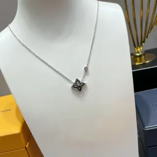 Collier Louis Vuitton argent et or pendentif étoile quatrefoil nacré