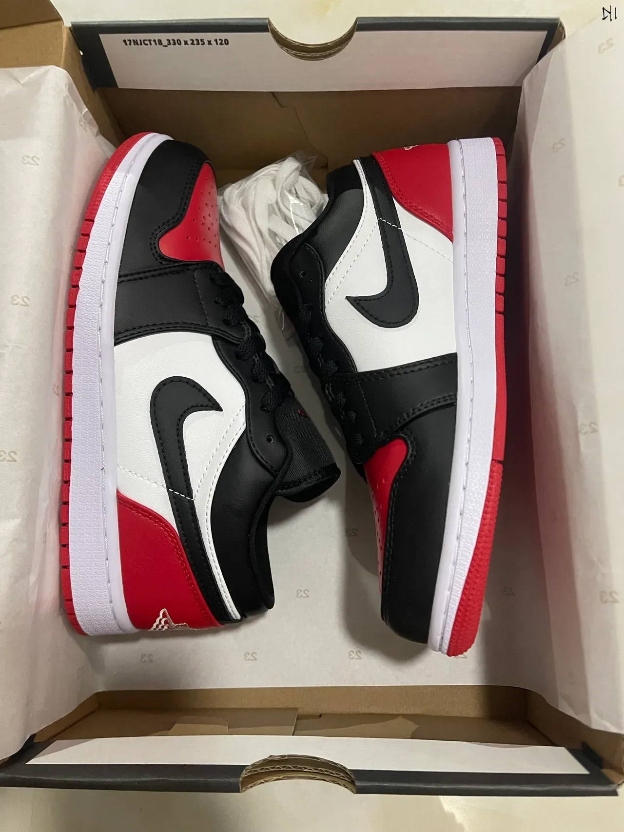 Nike Air Jordan 1 Low Noir Blanc Rouge chaussures lifestyle 7
