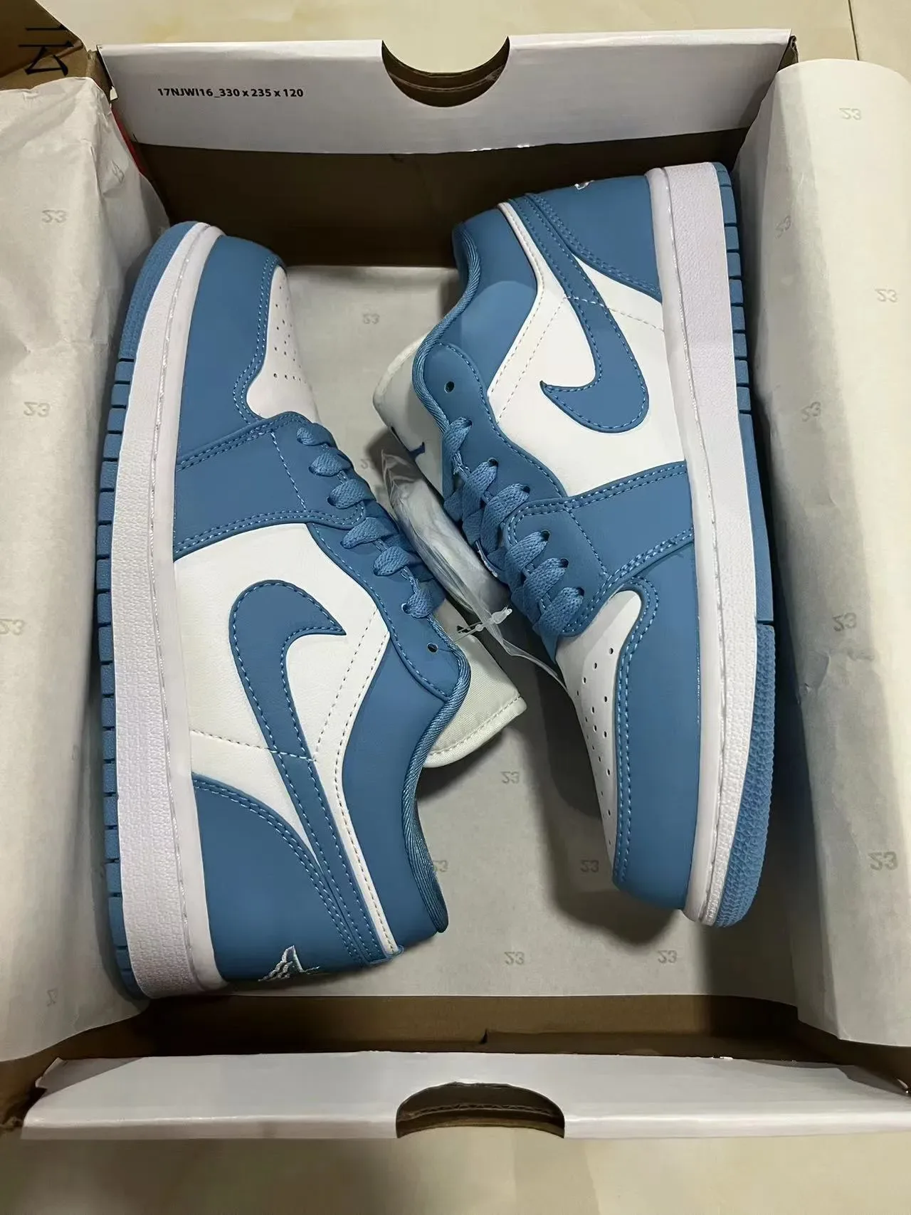 Nike Air Jordan 1 Low University Blue White tênis lifestyle 7