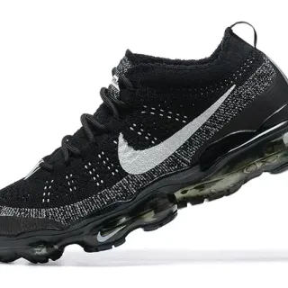 Chaussures de course Nike noires argentées Flyknit haut avec cushioning d'air visible sur la semelle