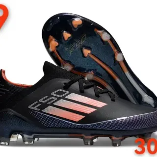 Adidas काला नारंगी लो-कट सिंथेटिक अपर ग्रेजिएंट स्ट्राइप डिटेलिंग फर्म-ग्राउंड सॉकर जूते
