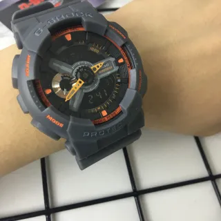 Casio G-Shock GA-100 ساعة رياضية رمادية وبرتقالية