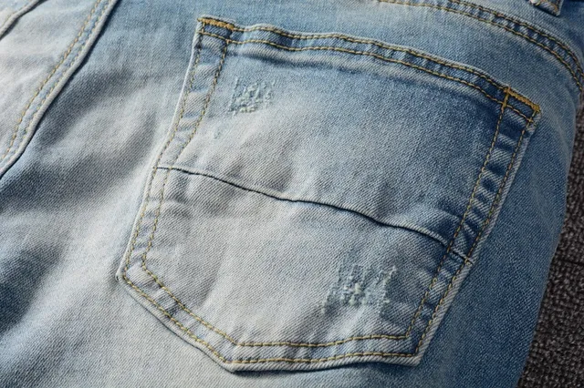 Distressed Slim-Fit Light-Wash Blue Jeans 15