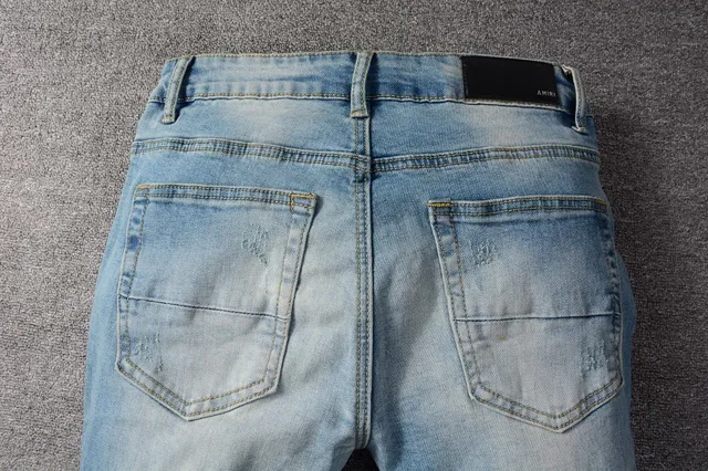 Distressed Slim-Fit Light-Wash Blue Jeans 16