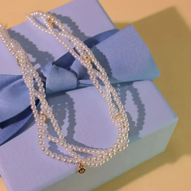 Multi-Strand Pearl and Crystal Charm Necklace 9