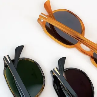 Marcos de acetato plegables naranja negro lentes ovaladas redondeadas gafas