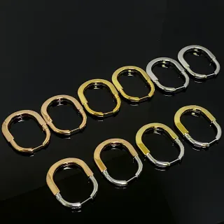 Two-Tone Gold and Silver Hinged Oval Hoop Earrings